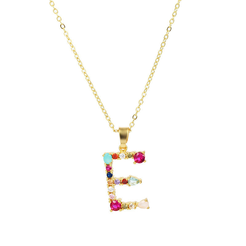 Collier avec lettres en pierres précieuses