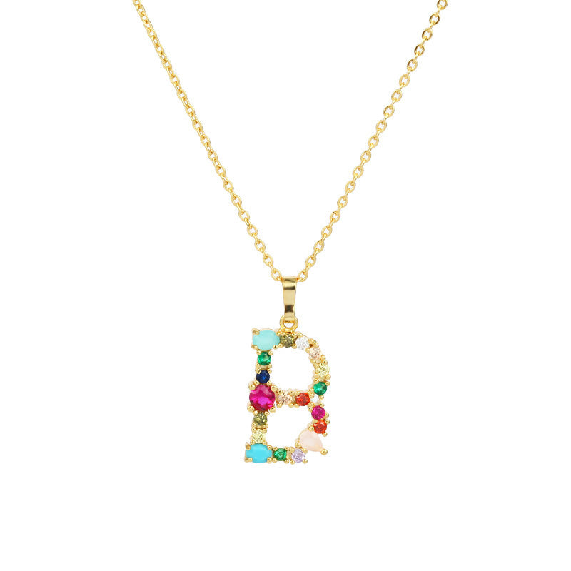 Collier avec lettres en pierres précieuses