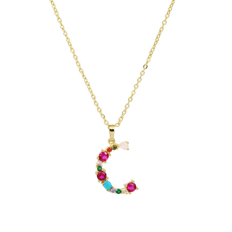 Collier avec lettres en pierres précieuses