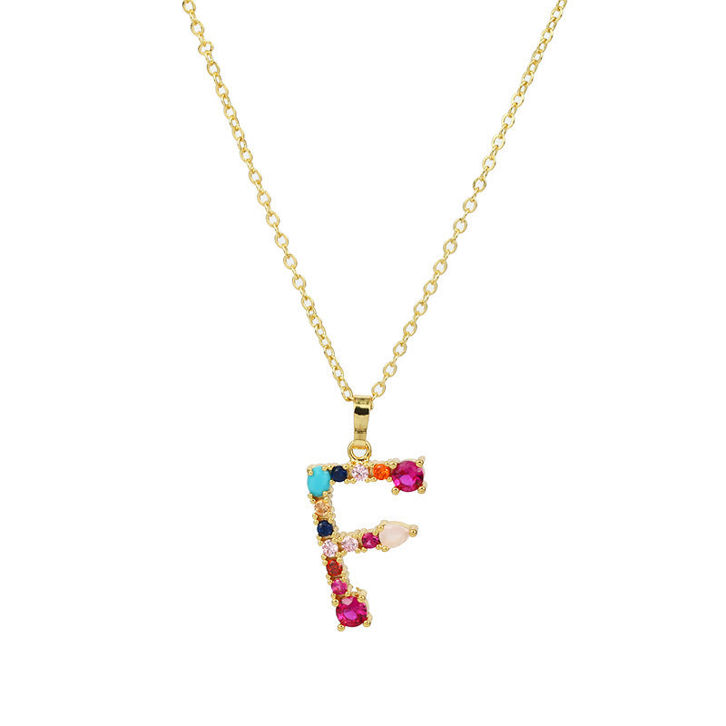 Collier avec lettres en pierres précieuses