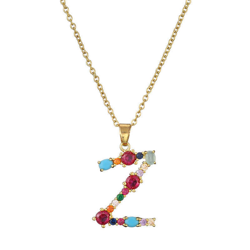 Collier avec lettres en pierres précieuses